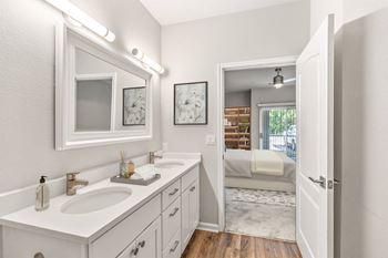 A white bathroom with a vanity and a mirror at Sweetgrass Landing, Mount Pleasant, South Carolina, 29466